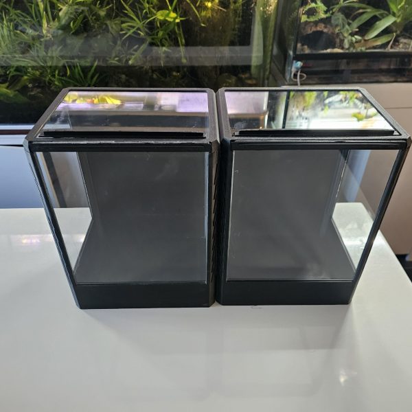 Two empty 3D-printed vivariums with sliding top and front panels, shown for size compa