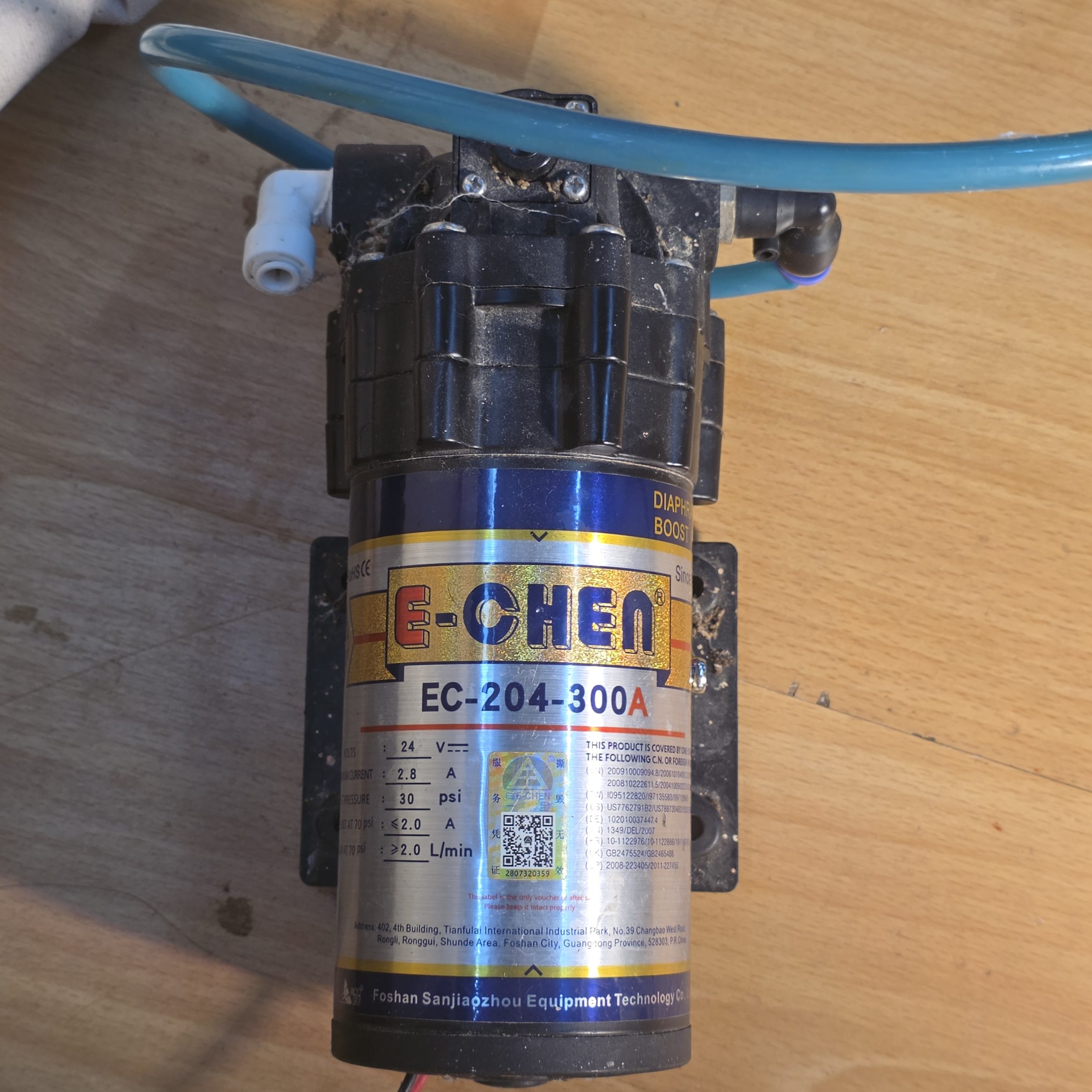 E-Chén misting pump used in a dart frog vivarium automatic misting system setup.