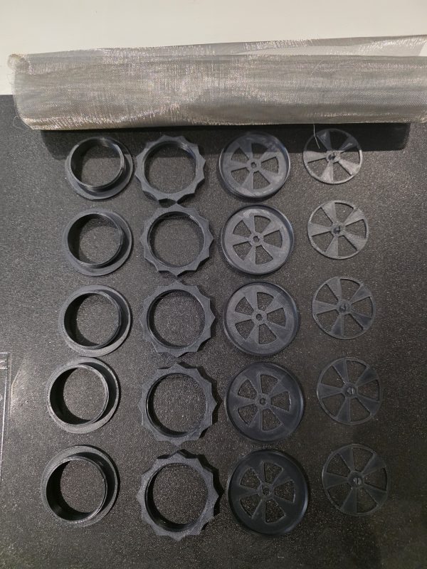 Components of Frogfather adjustable vents with stainless steel mesh before assembly