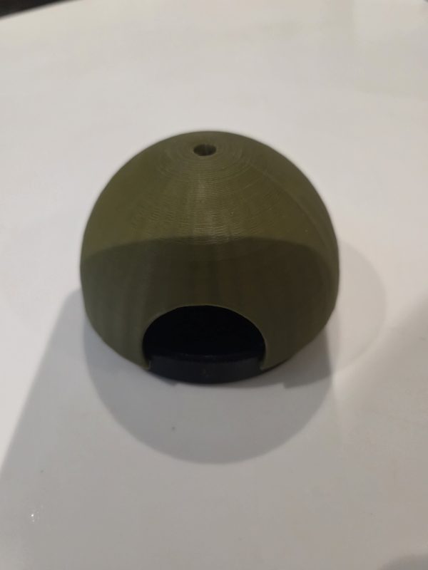 Front view of green Frogfather AquaDome dart frog spawning shelter showing wide entrance and included black 3D-printed breeding dish.
