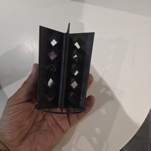 Black PETG reusable fruit fly media insert with vertical panels and diamond-shaped openings, photographed at Frogfather HQ